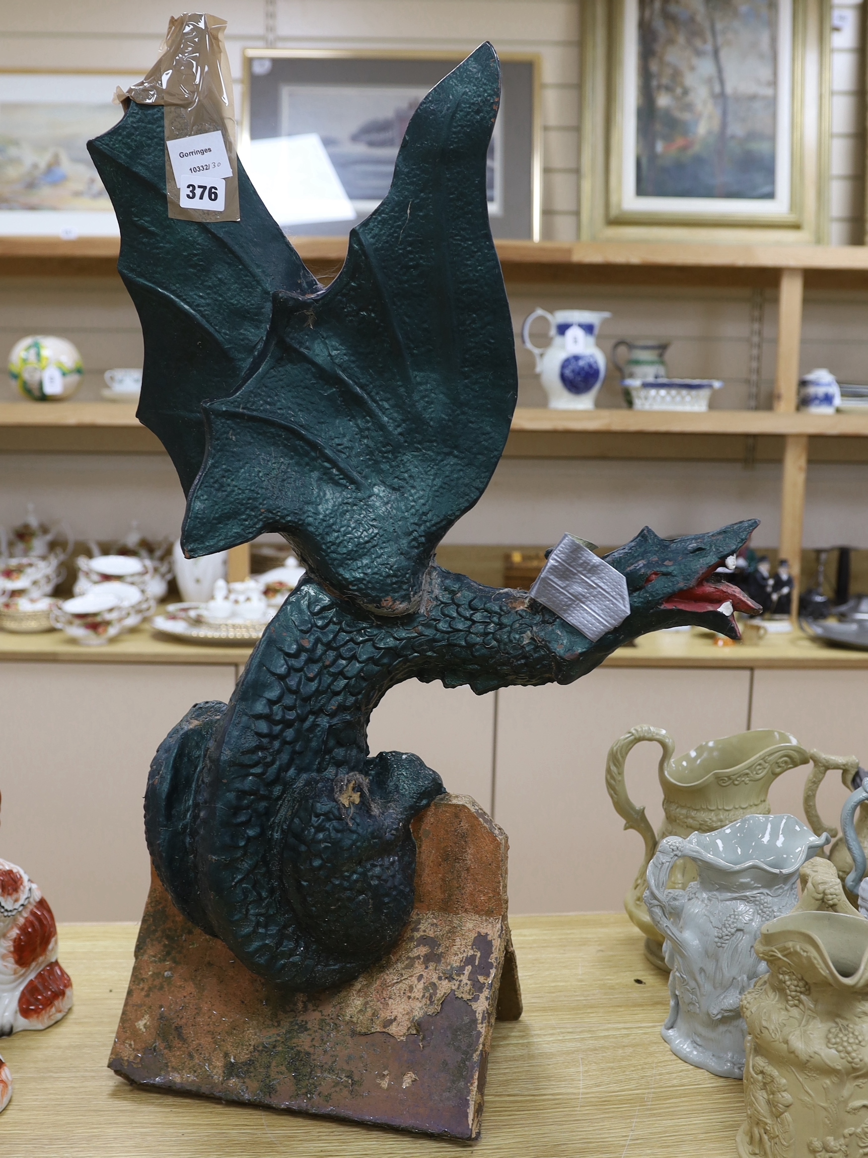A Chinese green painted terracotta ridge tile in the form of a dragon, 80cm high (af)